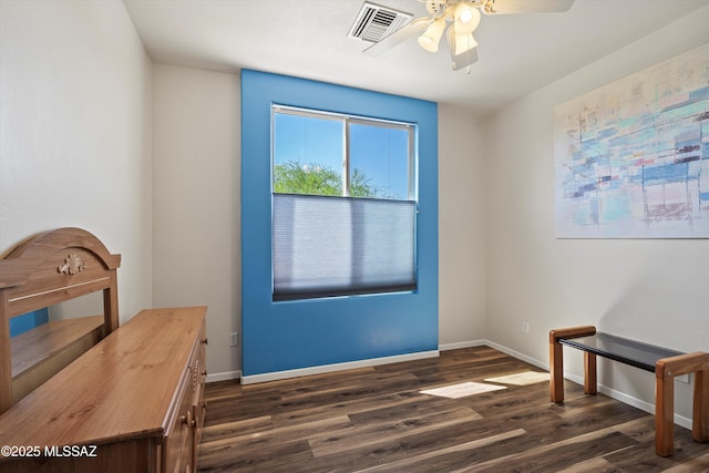 entryway with visible vents, a ceiling fan, baseboards, and dark wood-type flooring