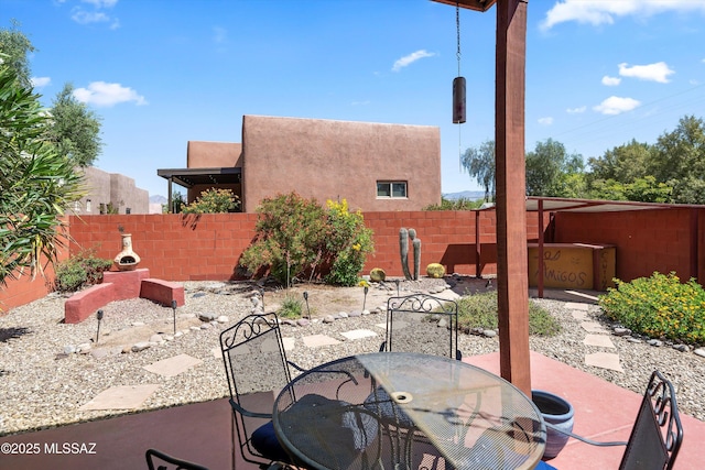 view of patio featuring a fenced backyard and outdoor dining space