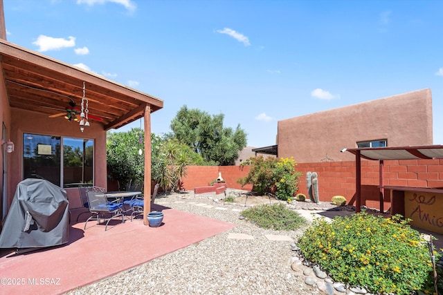 view of patio featuring ceiling fan, a fenced backyard, and a grill