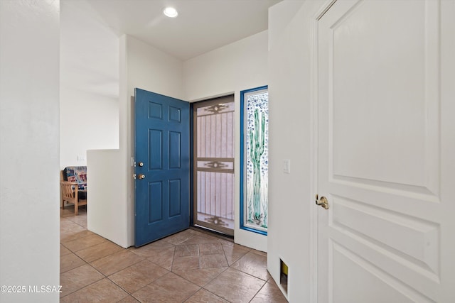 entryway featuring recessed lighting and light tile patterned floors