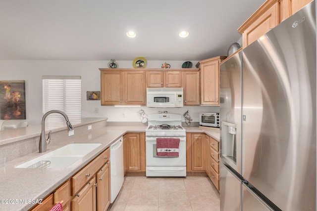 5354 W Eagle Claws Ct, Marana, AZ 85658 - kitchen with light brown cabinetry, white appliances, light tile patterned flooring, and a sink