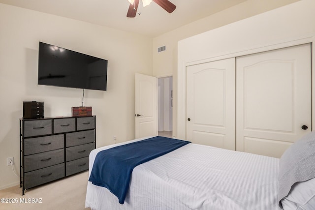 5354 W Eagle Claws Ct, Marana, AZ 85658 - bedroom featuring light colored carpet, a closet, baseboards, visible vents, and a ceiling fan
