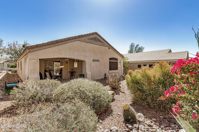 5354 W Eagle Claws Ct, Marana, AZ 85658 - back of house with stucco siding and a tiled roof