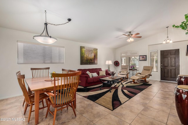 5354 W Eagle Claws Ct, Marana, AZ 85658 - dining space featuring light tile patterned floors, a ceiling fan, vaulted ceiling, and baseboards