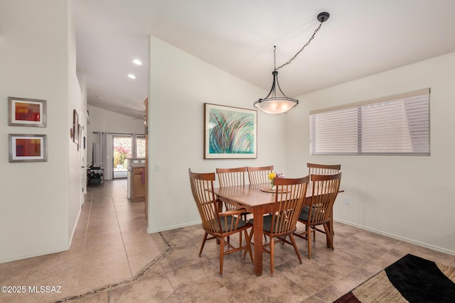 5354 W Eagle Claws Ct, Marana, AZ 85658 - dining area featuring lofted ceiling and baseboards