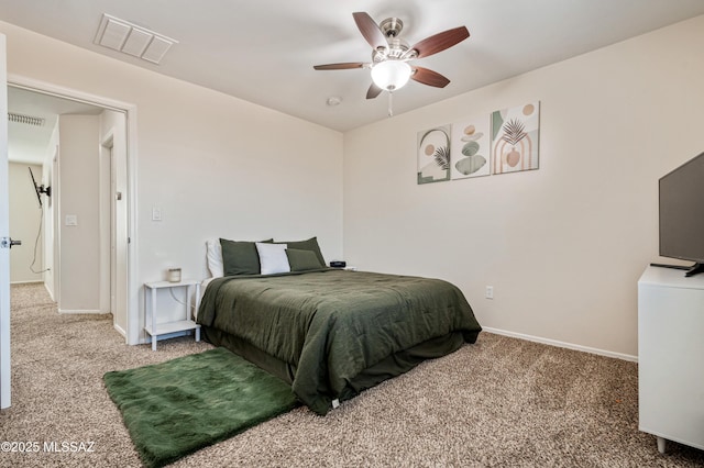 carpeted bedroom featuring baseboards, visible vents, and ceiling fan