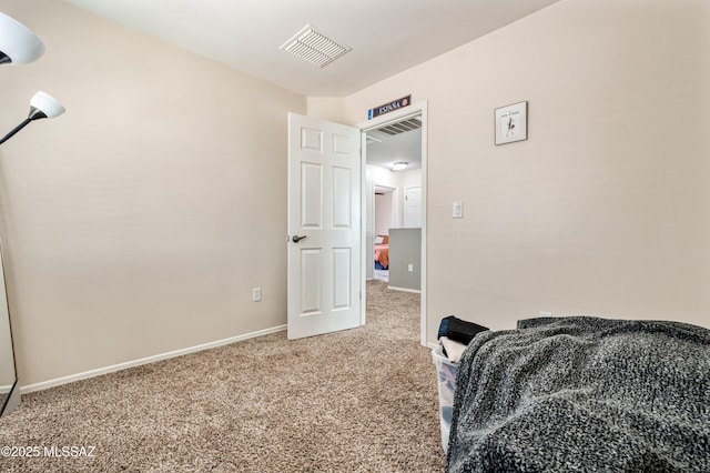 bedroom featuring carpet, visible vents, and baseboards