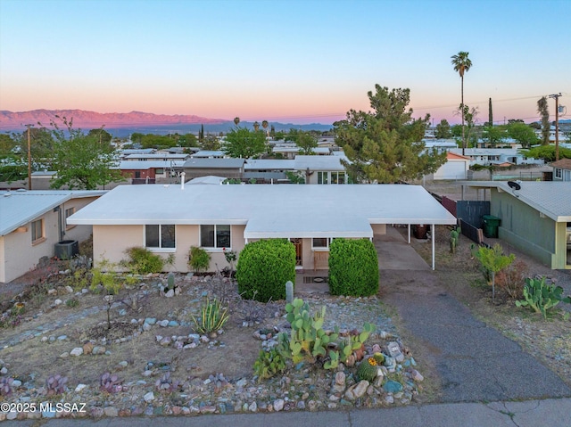 925 W 4th Ave, San Manuel, AZ 85631 - ranch-style home with a carport, a mountain view, asphalt driveway, and central AC