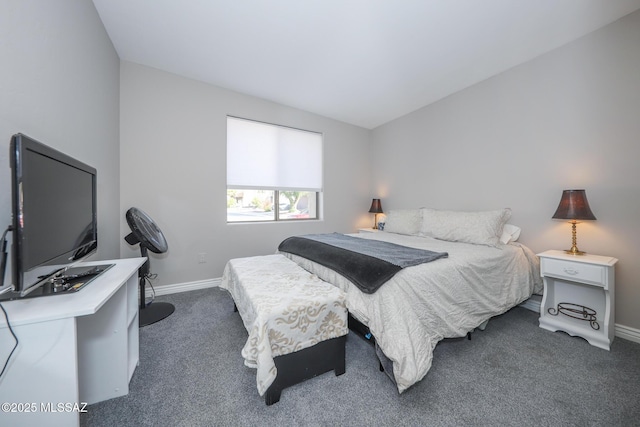 bedroom featuring baseboards and carpet