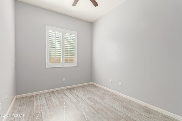 unfurnished room with light wood finished floors, a ceiling fan, and baseboards