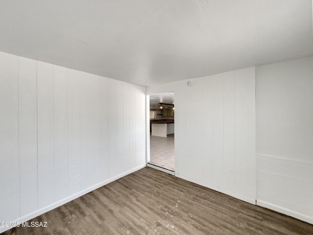 6760 S Calle Gavilan, Tucson, AZ 85746 - spare room with wood finished floors and baseboards