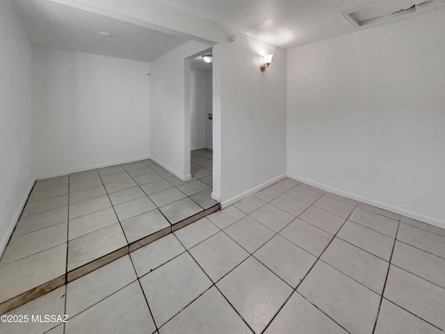 6760 S Calle Gavilan, Tucson, AZ 85746 - empty room with baseboards and light tile patterned flooring