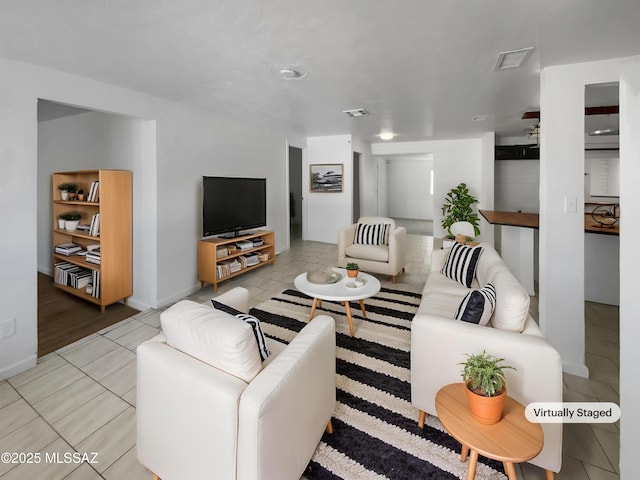 6760 S Calle Gavilan, Tucson, AZ 85746 - living area with visible vents, baseboards, and light tile patterned floors