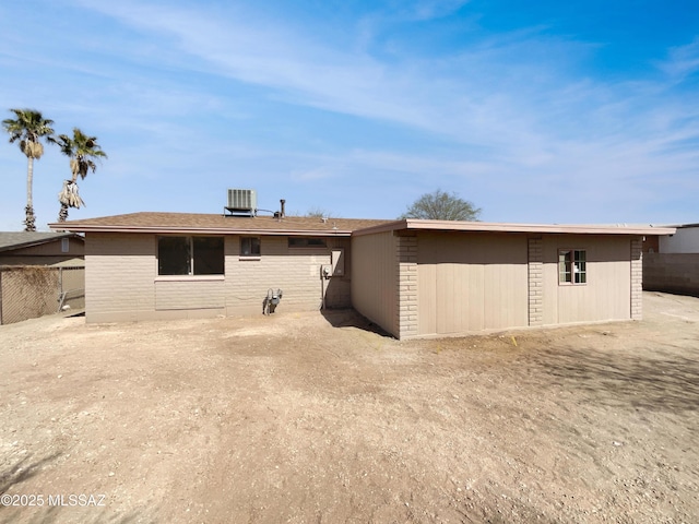 6760 S Calle Gavilan, Tucson, AZ 85746 - rear view of property featuring central AC unit, brick siding, and an outdoor structure