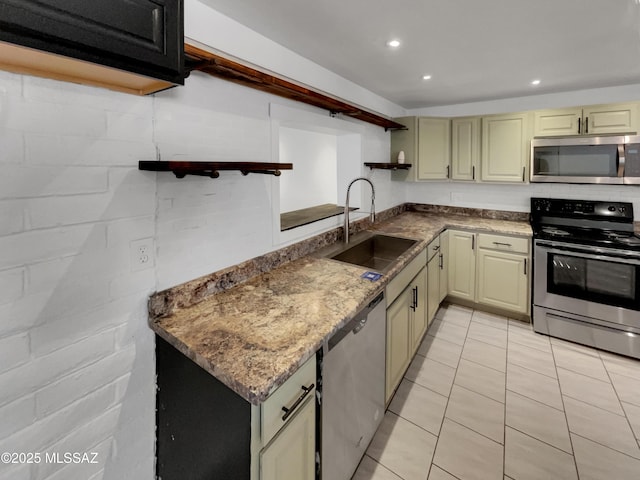 6760 S Calle Gavilan, Tucson, AZ 85746 - kitchen featuring open shelves, a sink, light tile patterned floors, cream cabinetry, and appliances with stainless steel finishes