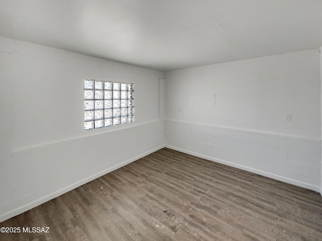 6760 S Calle Gavilan, Tucson, AZ 85746 - unfurnished room with baseboards and wood finished floors