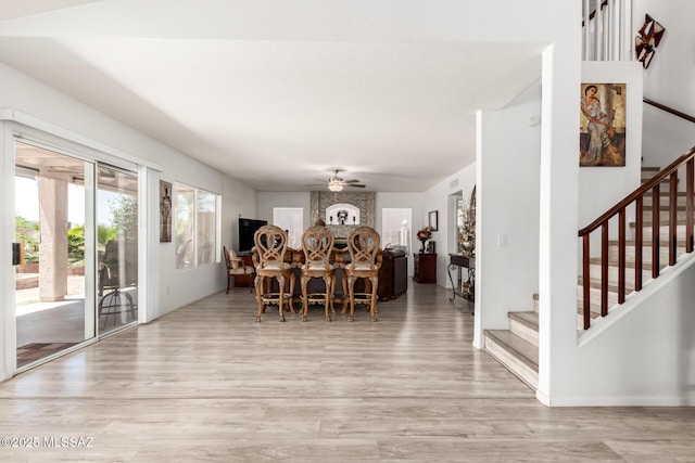 3825 W Perseus St, Tucson, AZ 85742 - dining space featuring wood finished floors, stairs, and ceiling fan