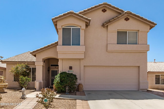 3825 W Perseus St, Tucson, AZ 85742 - mediterranean / spanish house with a garage, a tile roof, concrete driveway, and stucco siding