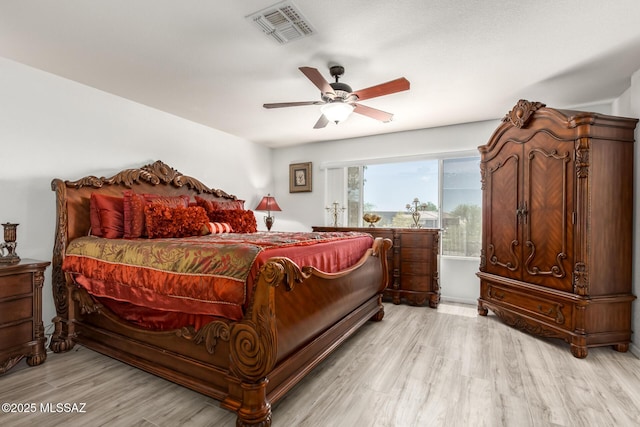 3825 W Perseus St, Tucson, AZ 85742 - bedroom with ceiling fan, light wood-style floors, and visible vents