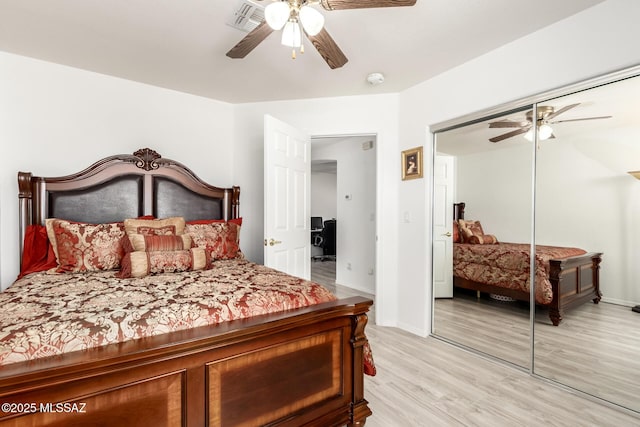 3825 W Perseus St, Tucson, AZ 85742 - bedroom with light wood-style flooring, a closet, baseboards, and ceiling fan