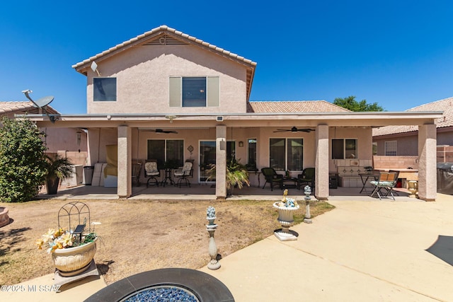 3825 W Perseus St, Tucson, AZ 85742 - back of property featuring stucco siding, a tile roof, a patio area, and ceiling fan