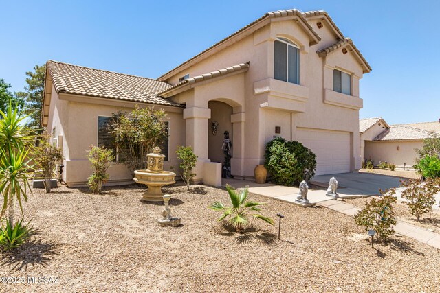 3825 W Perseus St, Tucson, AZ 85742 - mediterranean / spanish-style home featuring stucco siding, an attached garage, driveway, and a tiled roof