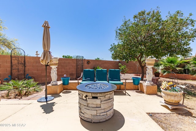 3825 W Perseus St, Tucson, AZ 85742 - view of patio featuring a fenced backyard and an outdoor fire pit