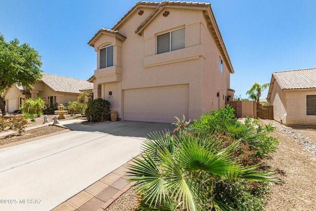 3825 W Perseus St, Tucson, AZ 85742 - view of front of home featuring an attached garage, driveway, fence, and stucco siding