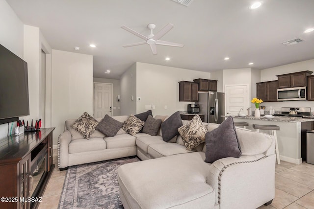 17949 S Whispering Glen Path, Sahuarita, AZ 85629 - living room with ceiling fan, light tile patterned floors, and recessed lighting