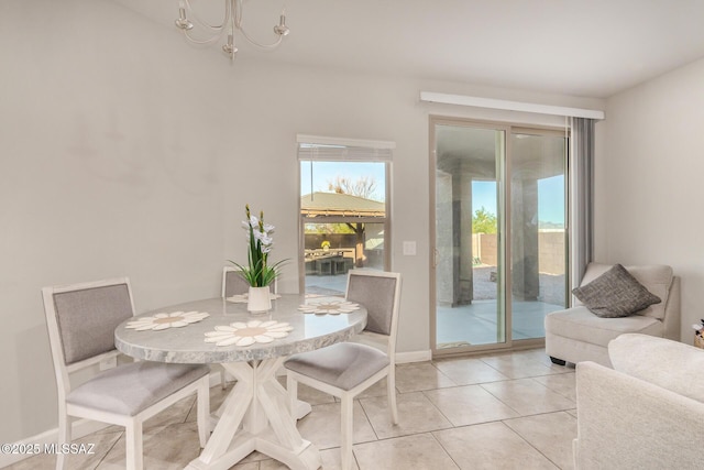 17949 S Whispering Glen Path, Sahuarita, AZ 85629 - dining room featuring a chandelier, light tile patterned flooring, and baseboards