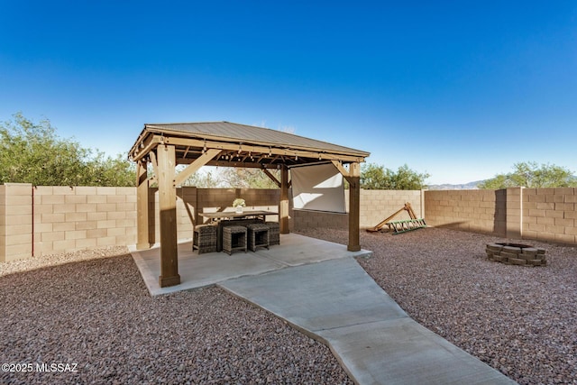 17949 S Whispering Glen Path, Sahuarita, AZ 85629 - view of patio / terrace with an outdoor fire pit, a gazebo, and a fenced backyard