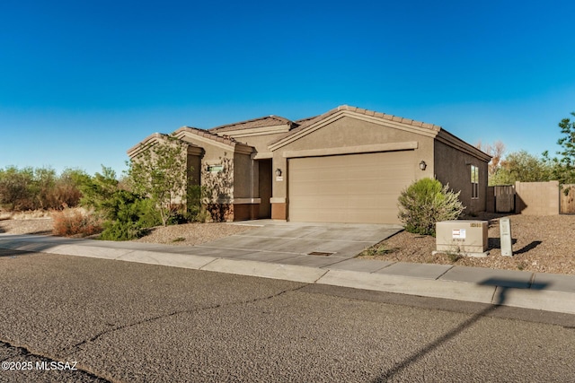 17949 S Whispering Glen Path, Sahuarita, AZ 85629 - ranch-style home featuring a garage, concrete driveway, stucco siding, and fence