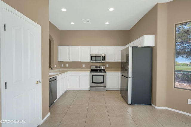38876 S Serenity Ln, Tucson, AZ 85739 - kitchen with white cabinets, appliances with stainless steel finishes, visible vents, and light countertops