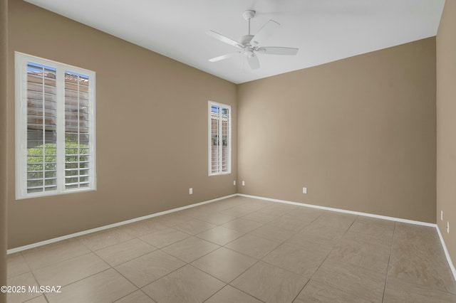 38876 S Serenity Ln, Tucson, AZ 85739 - empty room with ceiling fan, baseboards, and light tile patterned floors