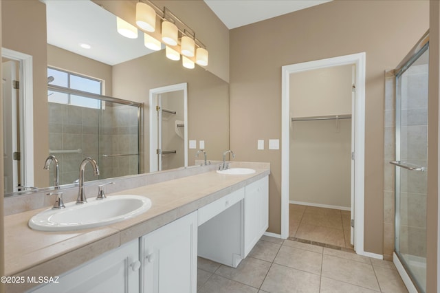 38876 S Serenity Ln, Tucson, AZ 85739 - bathroom with a spacious closet, a sink, and a stall shower