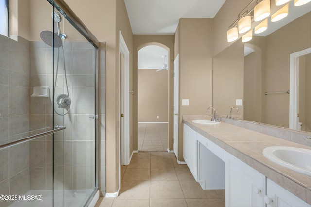 38876 S Serenity Ln, Tucson, AZ 85739 - bathroom with a shower stall, tile patterned flooring, and a sink