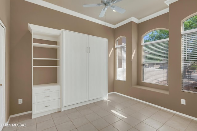 38876 S Serenity Ln, Tucson, AZ 85739 - unfurnished bedroom with baseboards, ornamental molding, and light tile patterned floors
