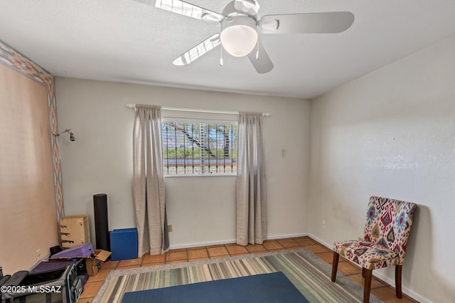 7361 E Riverbank Loop, Tucson, AZ 85715 - sitting room with tile patterned flooring and a ceiling fan