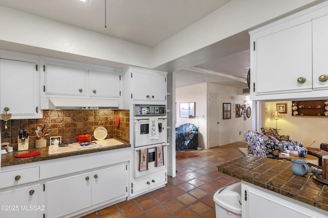 280 W Oak Hills Dr, Oracle, AZ 85623 - kitchen featuring white appliances, under cabinet range hood, backsplash, white cabinets, and dark tile patterned floors