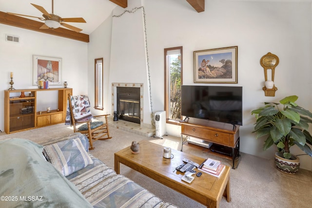 280 W Oak Hills Dr, Oracle, AZ 85623 - living room featuring carpet flooring, beamed ceiling, a ceiling fan, a fireplace, and high vaulted ceiling