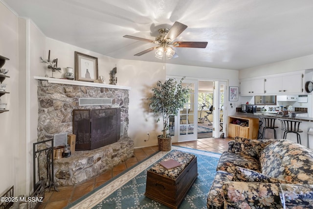 280 W Oak Hills Dr, Oracle, AZ 85623 - tiled living area featuring a ceiling fan, french doors, and a stone fireplace