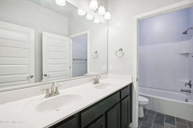 full bath with toilet, washtub / shower combination, a sink, and double vanity
