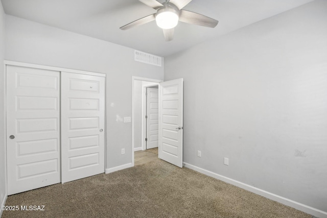 unfurnished bedroom with visible vents, a ceiling fan, a closet, baseboards, and carpet flooring