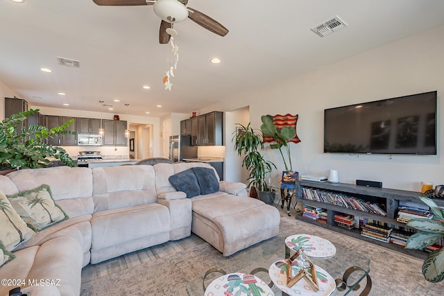21372 E Charmaine Rd, Red Rock, AZ 85145 - living room with visible vents, ceiling fan, and recessed lighting