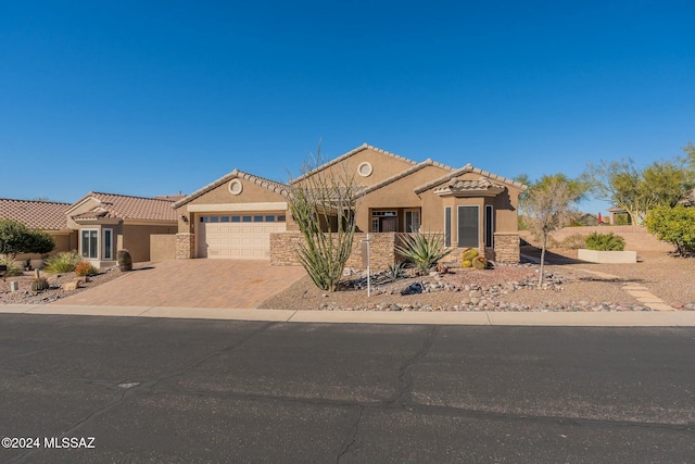 5152 W Heritage Gateway Pl, Marana, AZ 85658 - view of front of house with a garage, a tile roof, decorative driveway, and stucco siding