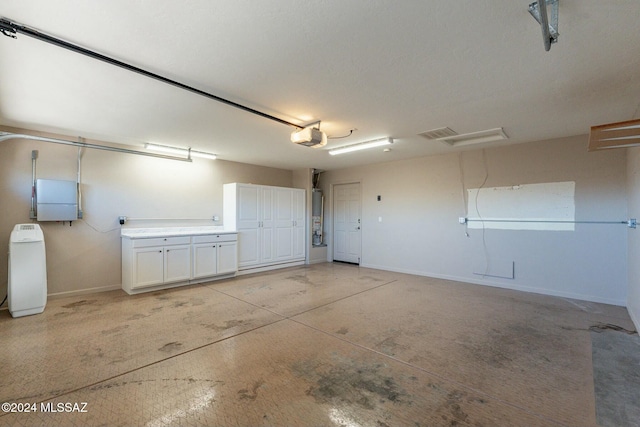 5152 W Heritage Gateway Pl, Marana, AZ 85658 - garage with water heater, baseboards, and a garage door opener
