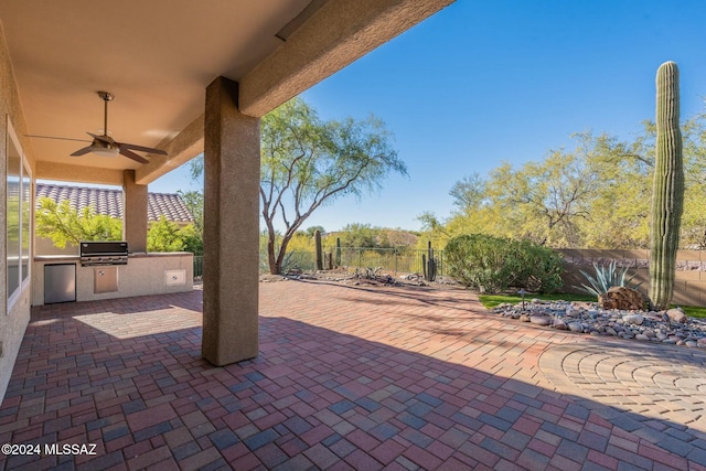 5152 W Heritage Gateway Pl, Marana, AZ 85658 - view of patio / terrace with a ceiling fan, an outdoor kitchen, area for grilling, and fence