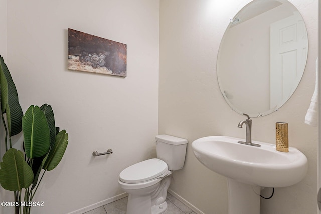10965 N Cormac Ave, Tucson, AZ 85742 - half bathroom featuring tile patterned flooring, toilet, and baseboards