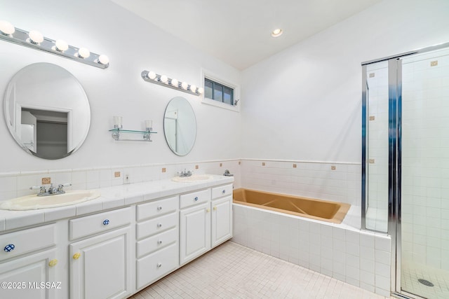 3748 N Sabino Ridge Pl, Tucson, AZ 85750 - bathroom with double vanity, a bath, tile patterned floors, a shower stall, and recessed lighting