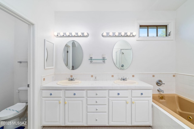 3748 N Sabino Ridge Pl, Tucson, AZ 85750 - bathroom with double vanity, a bath, and toilet